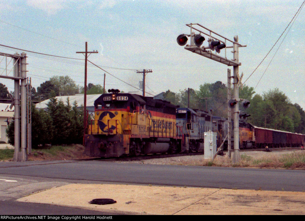 CSX 6034 leads a Norfolk Southern train out of Glenwood Yard